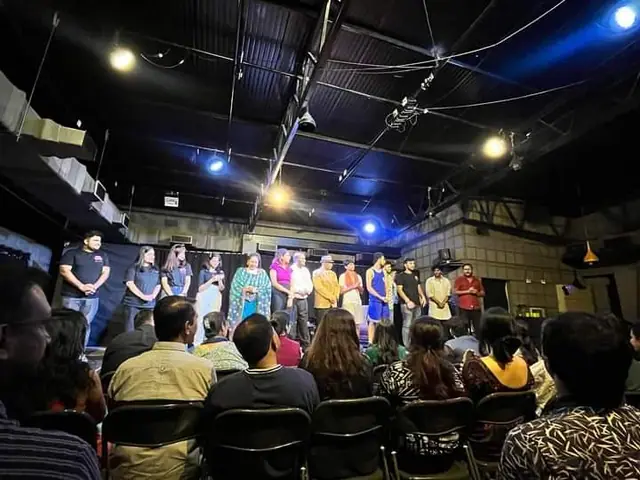 Cast on stage in front of the audience at a Theatrenama show