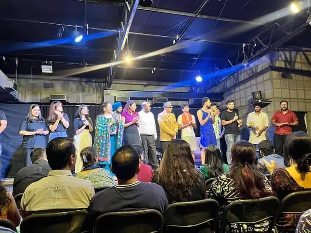 Cast on stage in front of the audience at a Theatrenama show
